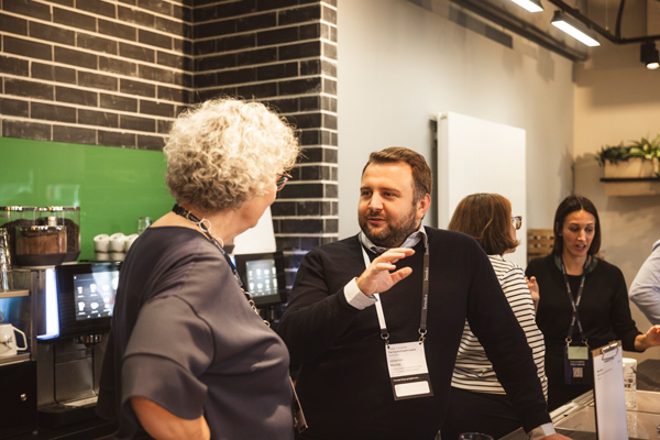 Participants exchanging ideas during a coffee break at Temedica’s “The Future of Health Insights” 2024 event, emphasizing collaboration, networking, and healthcare innovation dialogue