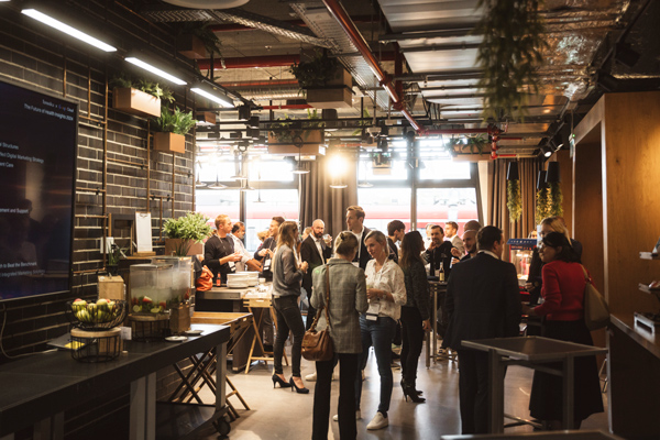 Professionals networking at Temedica’s “The Future of Health Insights” 2024 event, showcasing innovation, collaboration, and digital health strategy in a modern venue